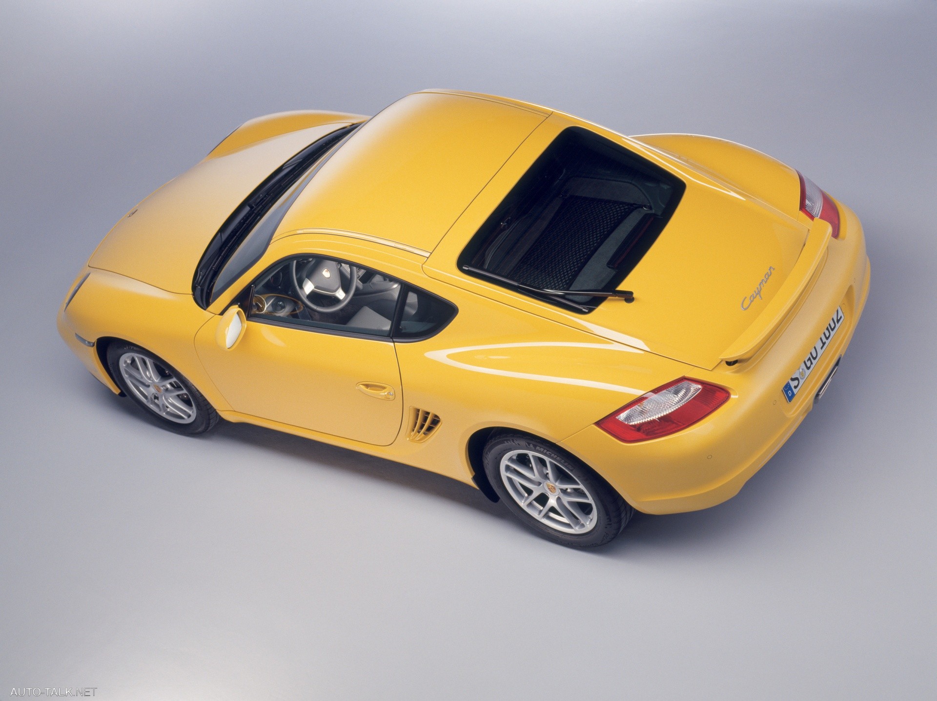 Желтая машина купить. Порше Кайман 2006. Порше Кайман желтый. Porsche Cayman 987.1. Порш Кайман 2007 жёлтый.